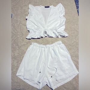 Two piece white crop top and short set